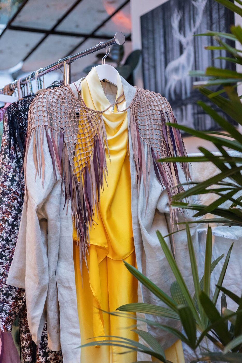 Robe detail — leather macramé fringe